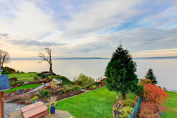 istock Panoramic view of backyard area. Luxury house exterior 586069342