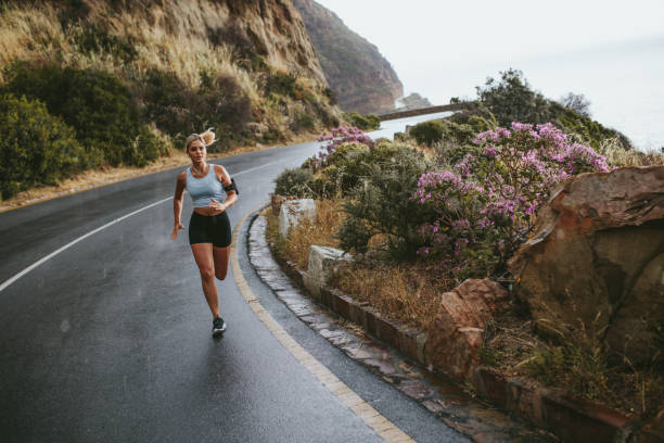 istock Fit female training outdoor in beautiful landscape 586069604