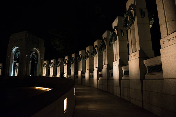 istock National World War Two Memorial at night in Washington DC 586069660