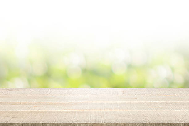 wood table top panel on green background stock photo