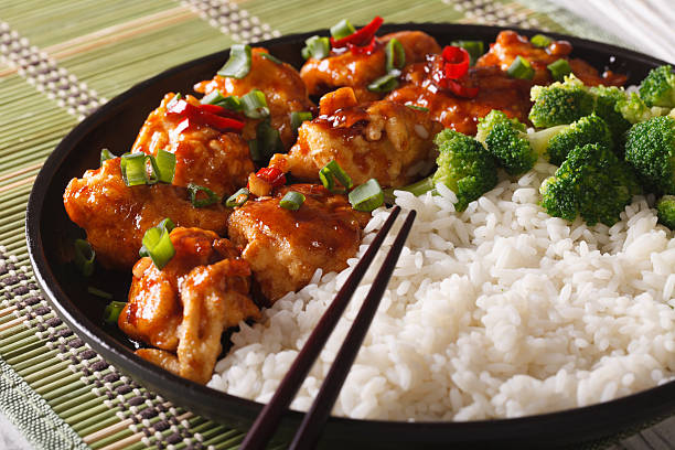 istock Asian Chicken tso with rice and broccoli close-up. Horizontal 586071036