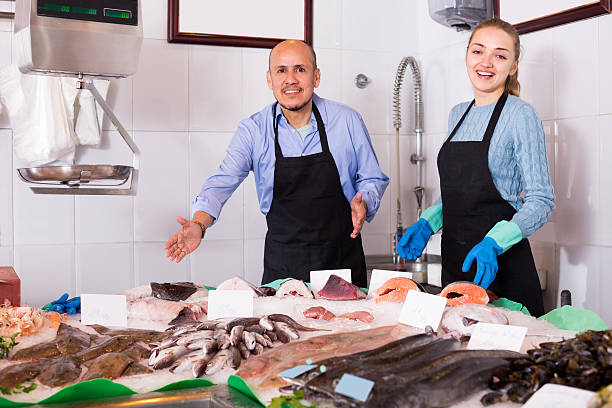 istock Two sellers in fish store 586071142