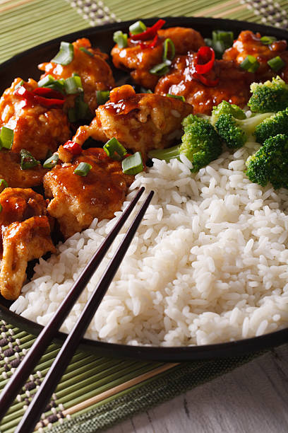 istock Asian cuisine: chicken in sauce with rice and broccoli closeup. 586071306
