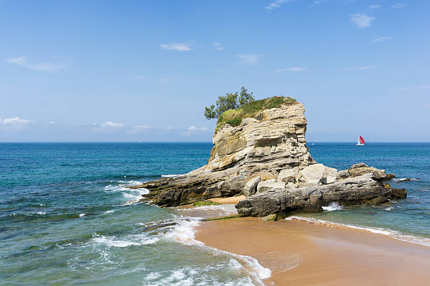 istock Big rock at the end of the beach 586072124