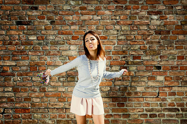 istock Cheerful girl shows tongue 586074938