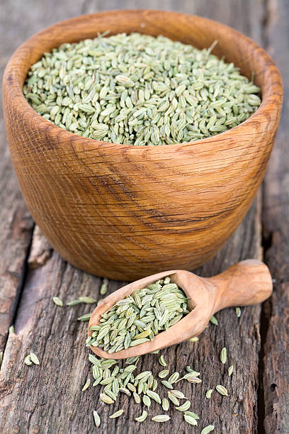 istock fennel seeds on wooden surface 586076946