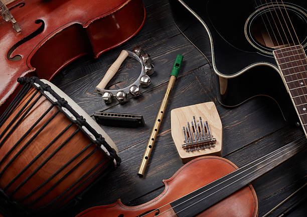 Set of musical instruments on dark wooden background stock photo
