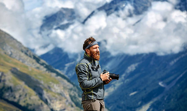 istock hiker at the top of a pass 586079882