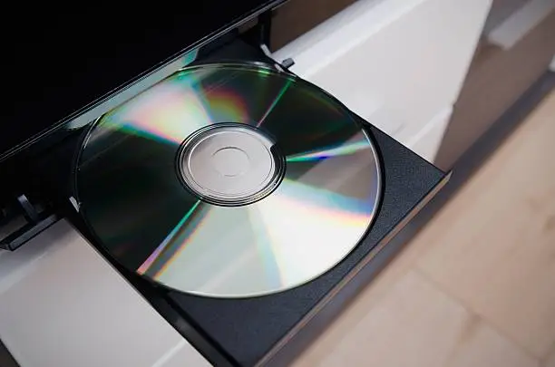Close up of Blu-ray or DVD player with inserted disc