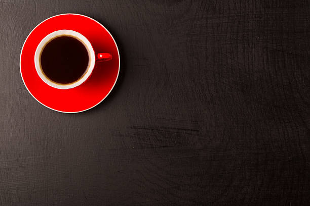 istock Aroma coffee cup and wooden black background 586082812