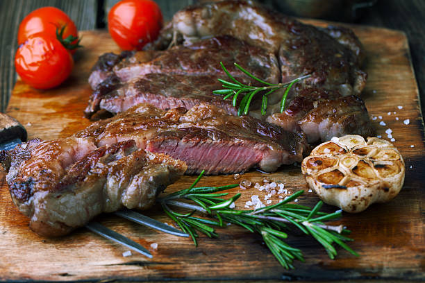 istock Grilled ribeye steak marbled meat with rosemary 586085852