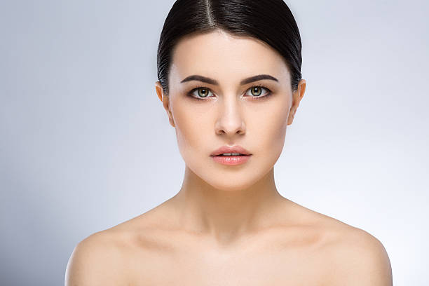 istock Darkhaired girl with nude make up at studio 586085876