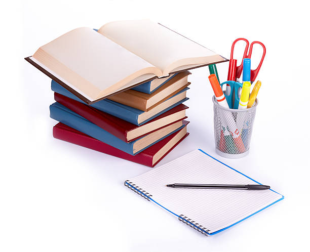 istock Pile of books, writing-book and pen 586086170