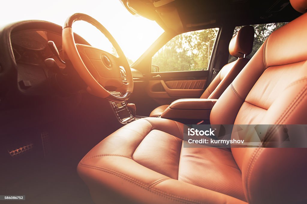 Premium car interior, brown leather at sunset Car Stock Photo