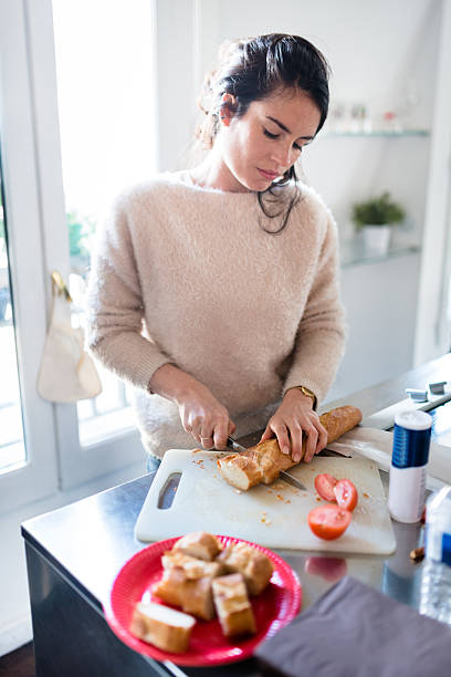 istock french woman preparing food on the kitchen 586087144