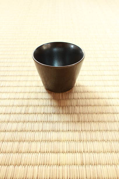 istock Small sake cup on Tatami mat 586089394
