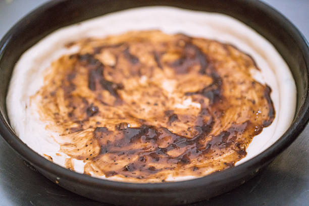 istock pizza dough with sauces  in the kitchen 586090414