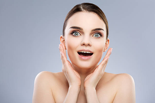 istock Surprised smiling girl 586090950