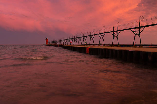 istock Colorful sunrise sky with lighthouse 586091620