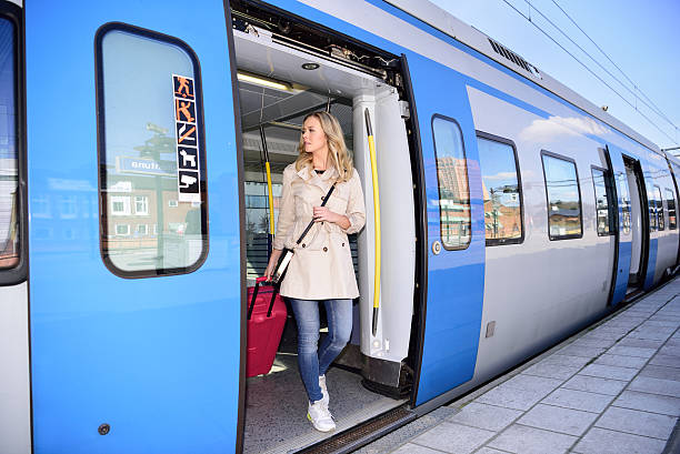 istock Blonde Swedish woman exiting commuter subway train 586160856