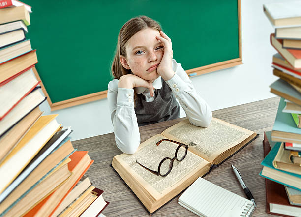 istock Sleepy exhausted or bored young student. 586164004