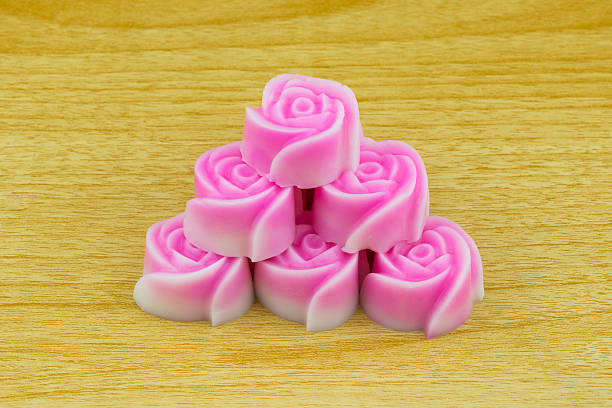 istock rose jelly cubes isolated on wood background 586167294