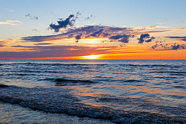 istock Beautiful Sunset Over Baltic Sea with cloud and beams, Jurmala 586170430