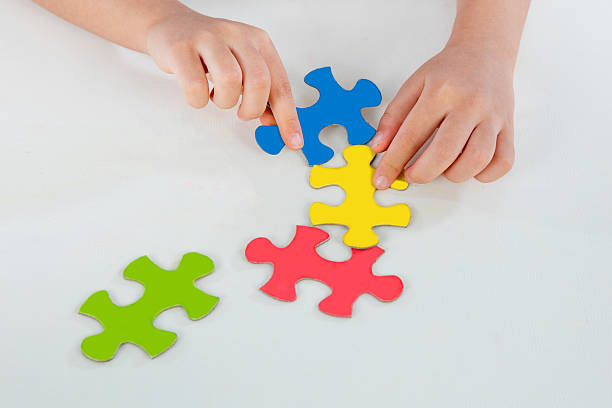 istock Child Playing Colorful Puzzle 586170510