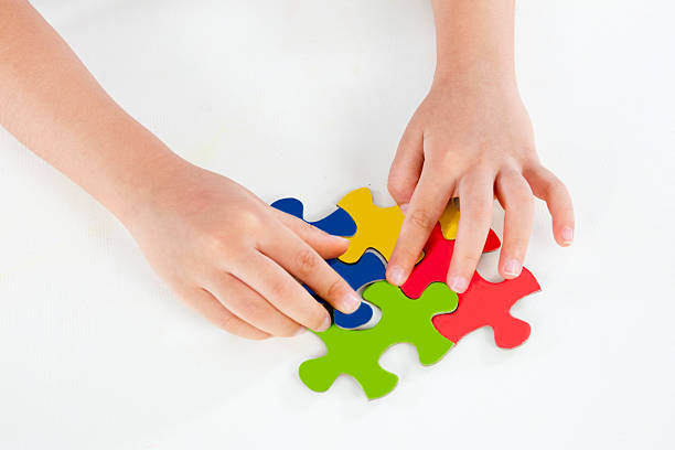istock Child Playing Colorful Puzzle 586170556