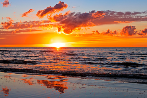 Beautiful Sunset Over Baltic Sea with cloud and beams, Jurmala