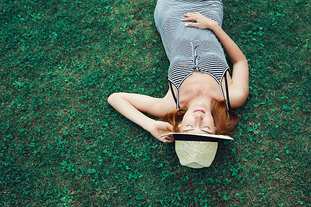 istock Trendy Hipster Girl Relaxing on the Grass 586171906