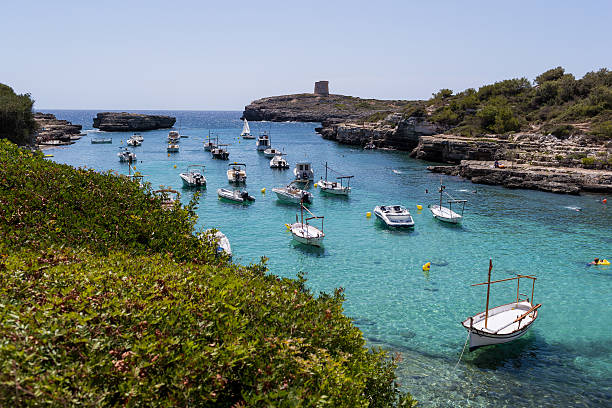 istock Boats in turquoise water bay 586174108