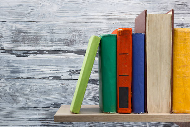 istock Stack of hardback books on wooden table. Back to school 586174148