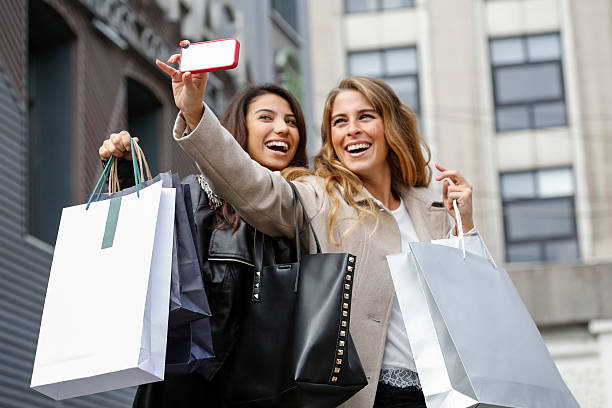 istock Young women with shopping bags 586174678
