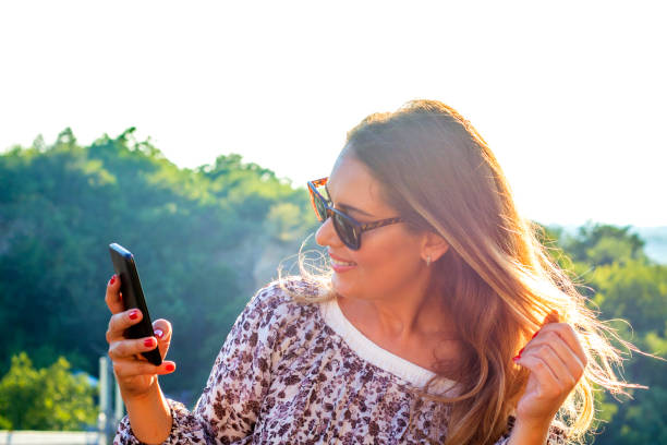 istock Young woman using smart phone 586174692
