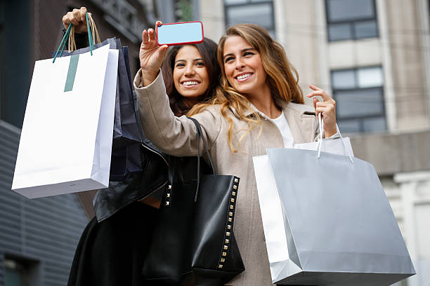 istock Young women with shopping bags 586174752
