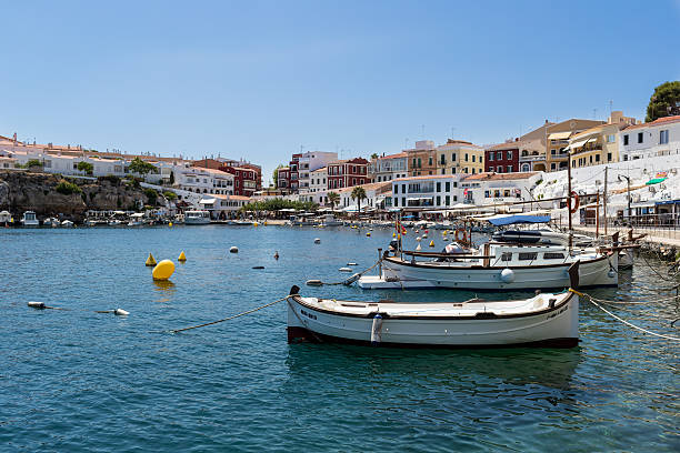 istock Boats in harbour and village 586175342
