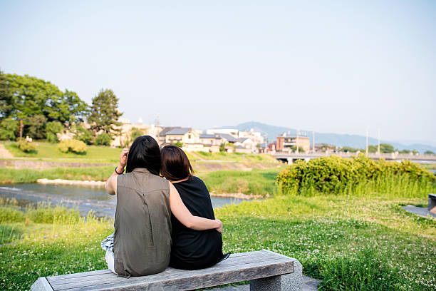 istock LGBT couple sat lovingly together 586175362
