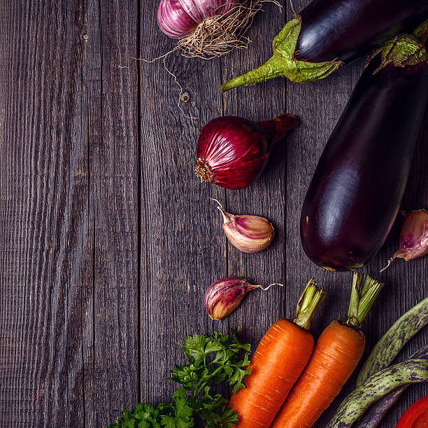 istock Fresh vegetables for cooking on dark wooden background. 586175654