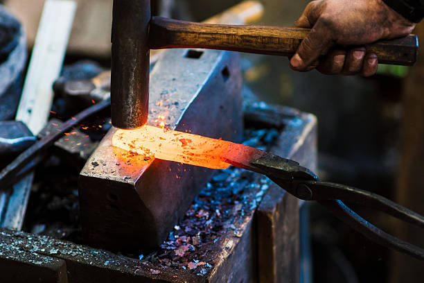 Blacksmith shaping a traditional Japanese cooking knife