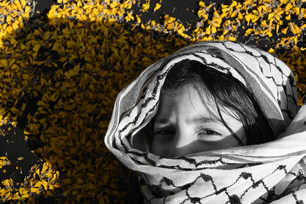 istock sad Arab girl 586177466