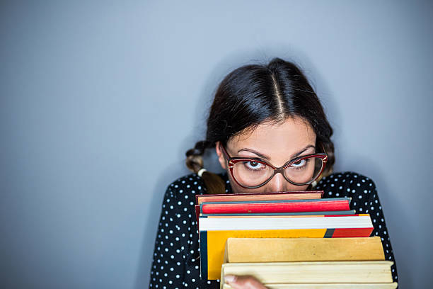 istock Shy confused  nerd woman 586180234