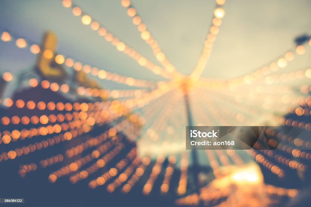 blurred background of string light bulb and blue sky background blurred background of  string light bulb  hanging for decorative exterior night party and blue sky background Night Stock Photo