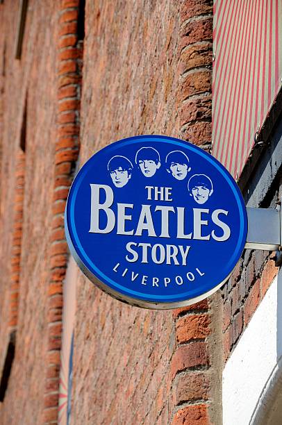 The Beatles Story sign, Liverpool. Liverpool, United Kingdom - June 11, 2015: Sign on the outside of The Beatles Story building at Albert Dock, Liverpool, Merseyside, England, UK, Western Europe. beatles stock pictures, royalty-free photos & images