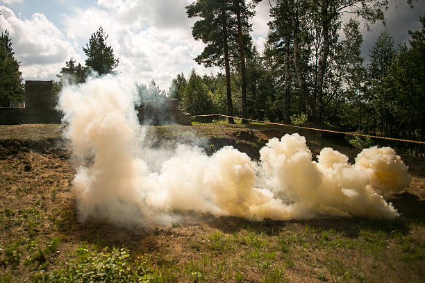 istock Orange army smoke bomb 586186410