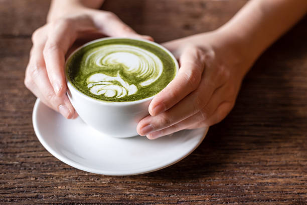 istock matcha gren tea latte with rose pattern latte art 586188706
