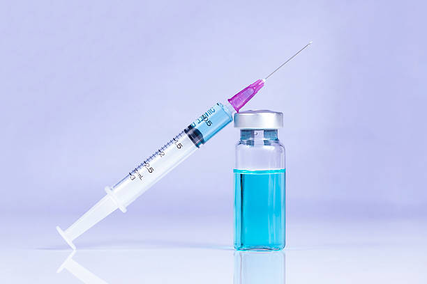 istock Injection needle for the treatment and vaccine in bottle 586193168