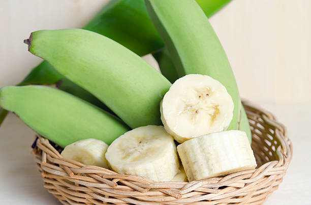 istock Banana fruit sliced on plate with leaf 586195854