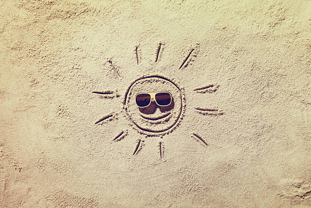 Top view of sandy beach with symbol and copy space