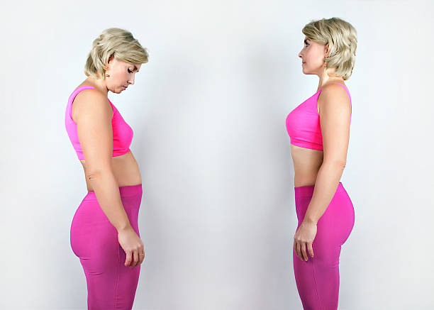 Photo full and thin girl in a pink suit A portrait in profile before and after weight loss girl posture photos stock pictures, royalty-free photos & images